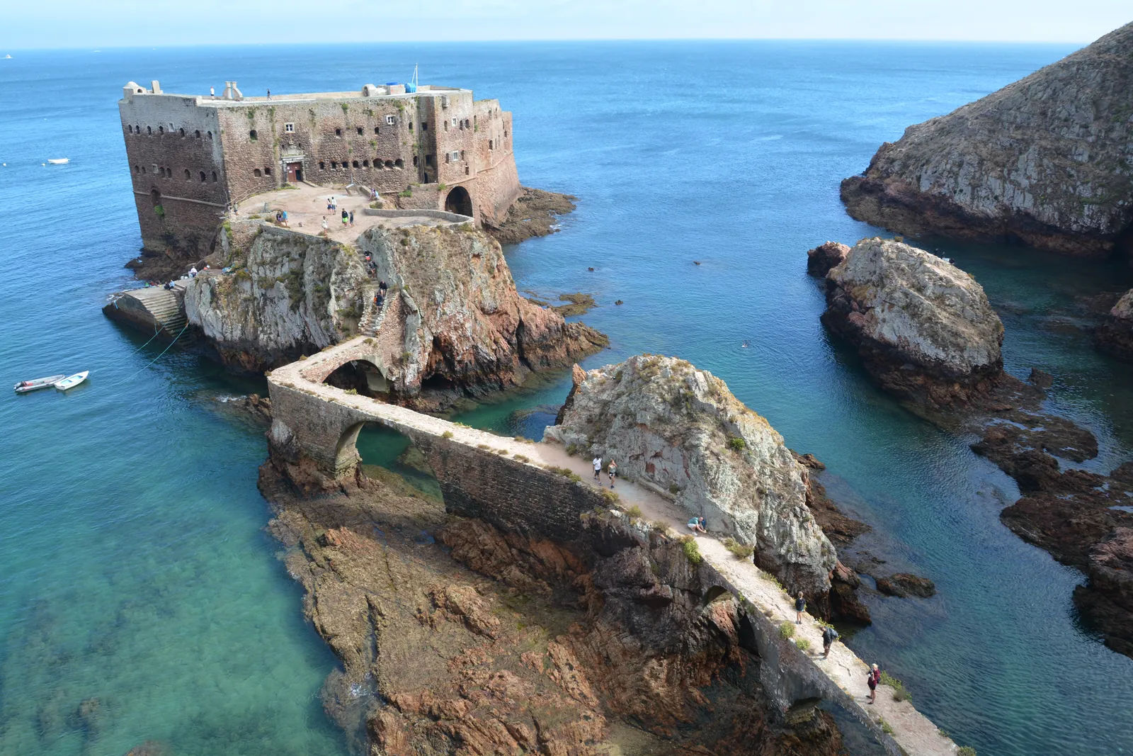 The Fort of São João Baptista on its islet, linked to Berlenga Grande by a stone bridge over turquoise water