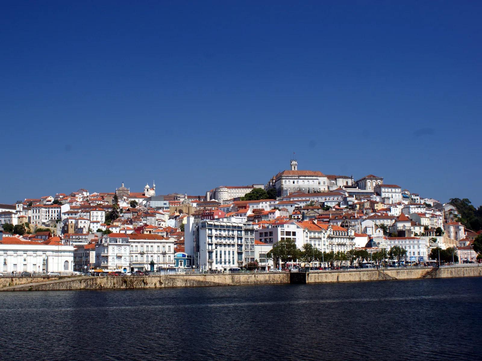 Coimbra's old town rising on its hill above the Mondego river, crowned by the university tower