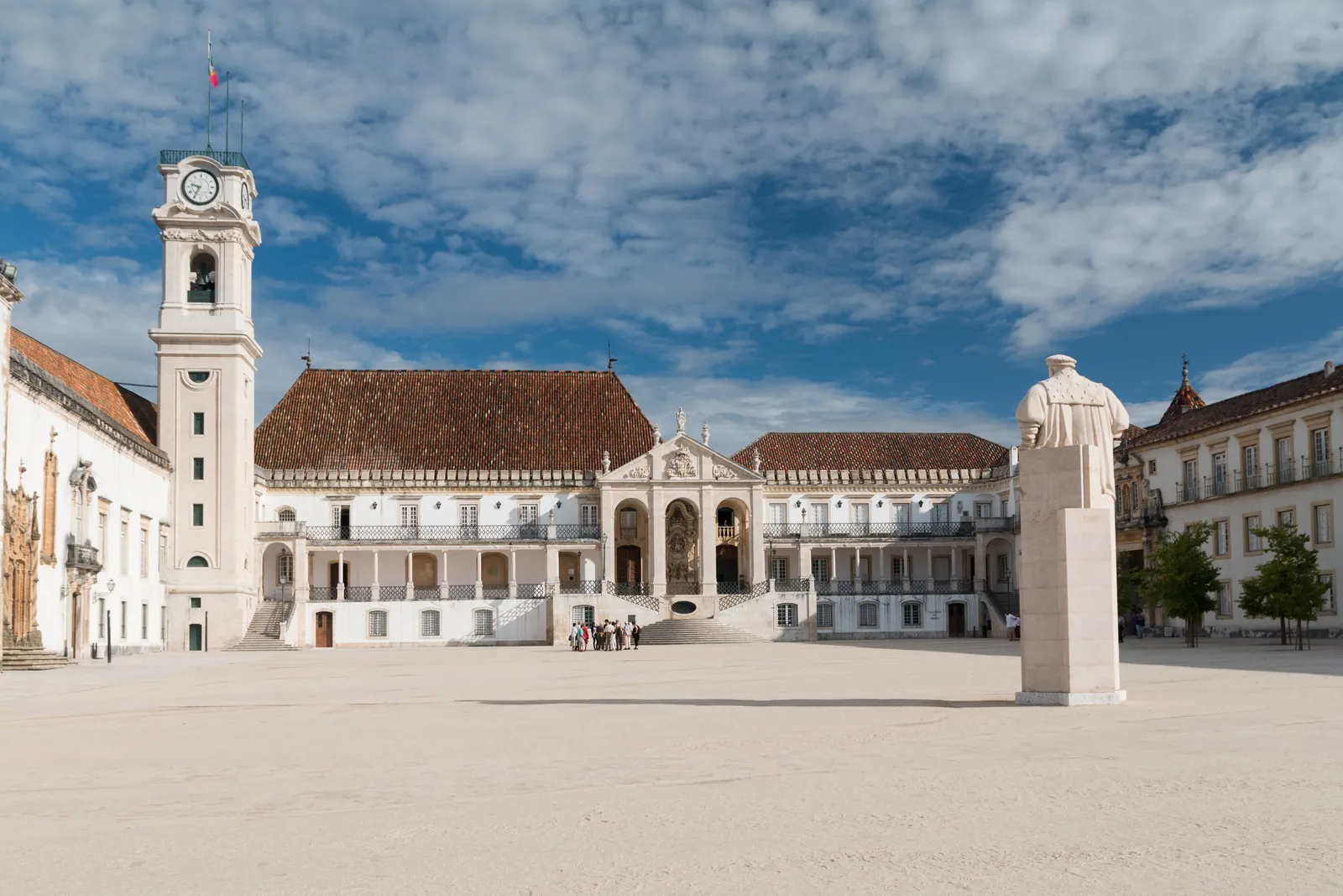 The Paço das Escolas courtyard of the University of Coimbra, with its baroque clock tower and the Via Latina