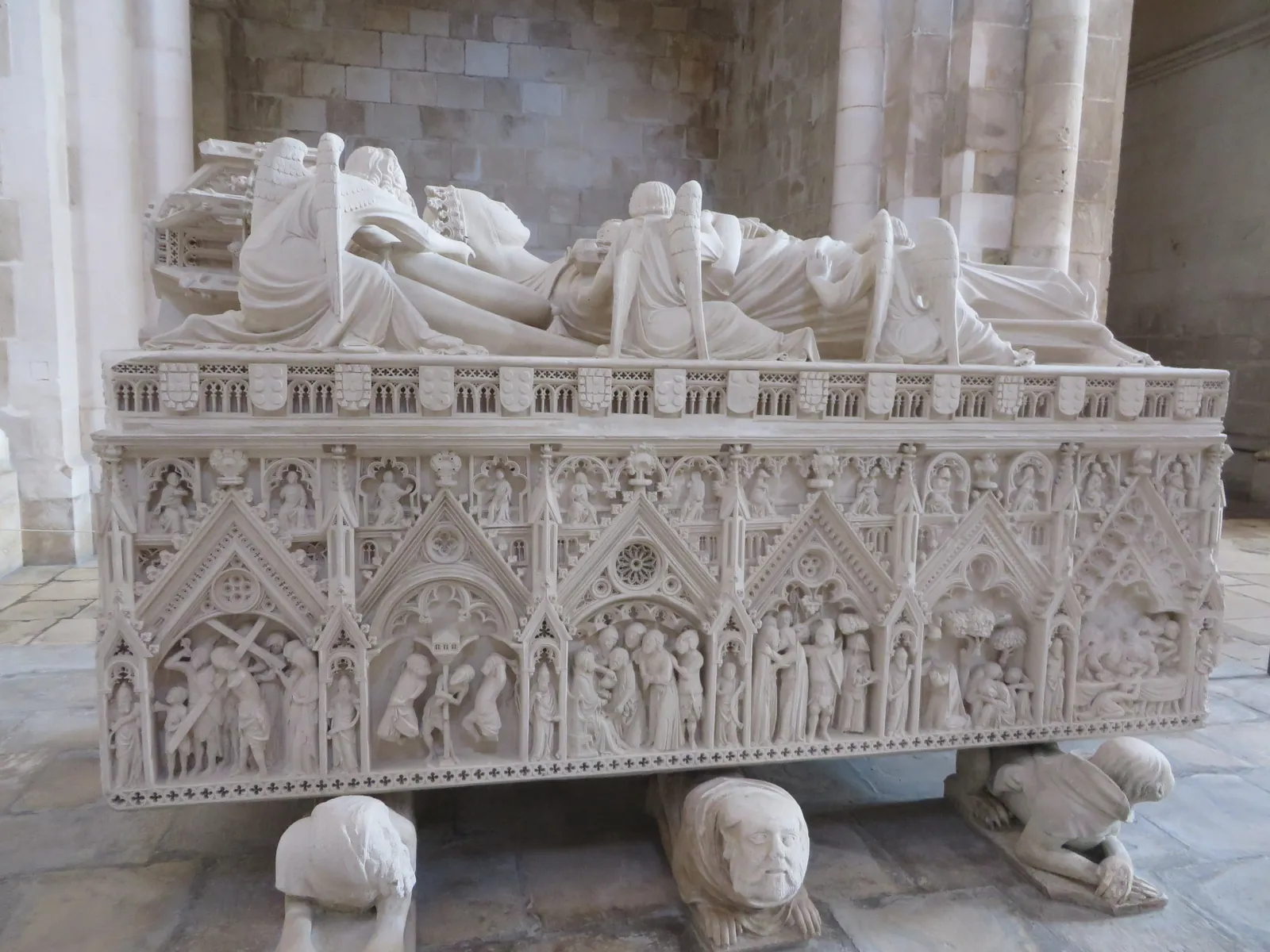 The carved Gothic limestone tomb of Inês de Castro in Alcobaça Monastery, her effigy attended by angels