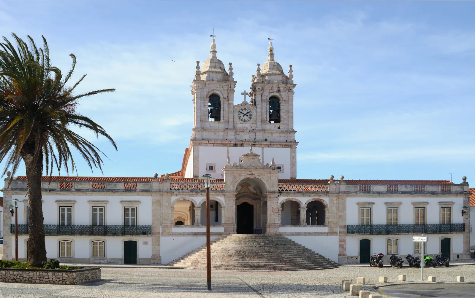 The twin-towered Sanctuary of Our Lady of Nazaré and its wide stone staircase on the Sítio square