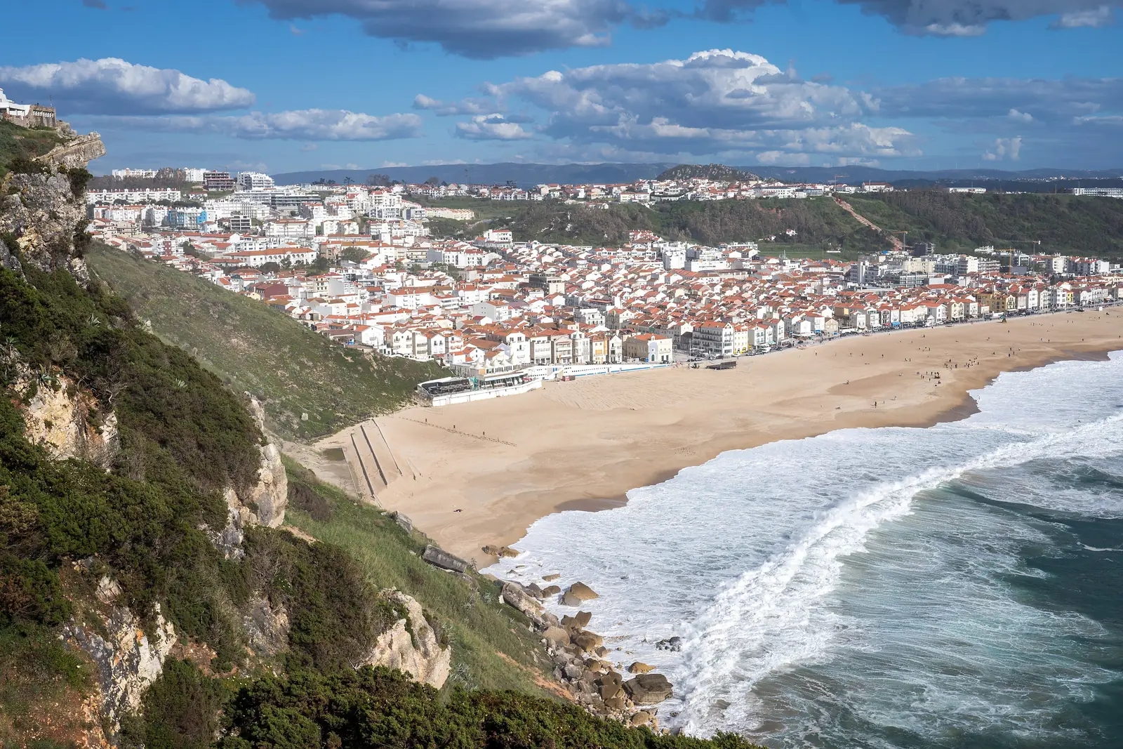 Nazaré bay and town from the hillside, with the beach curving south