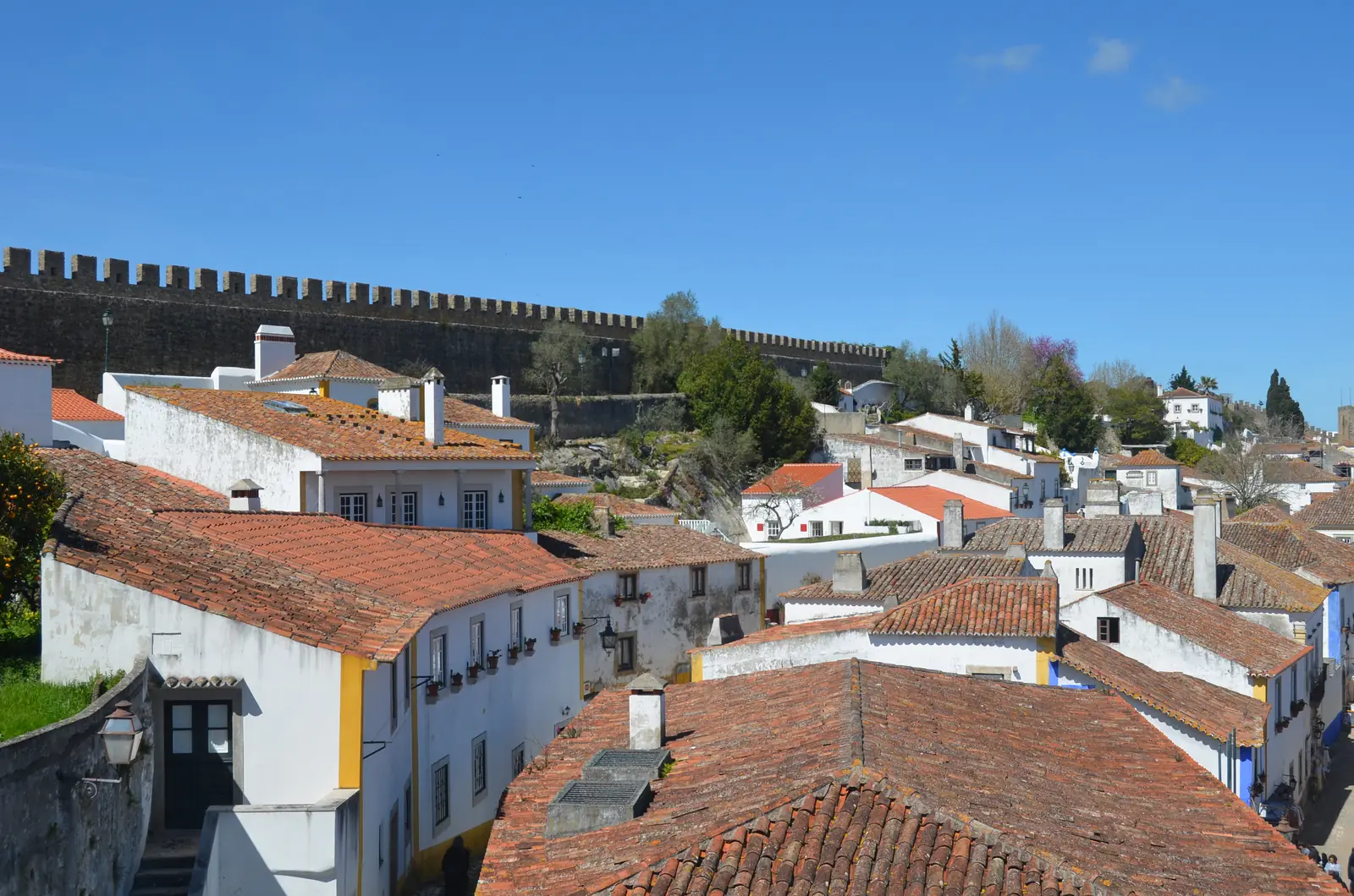 Terracotta roofs and white houses seen from the medieval walls of Óbidos