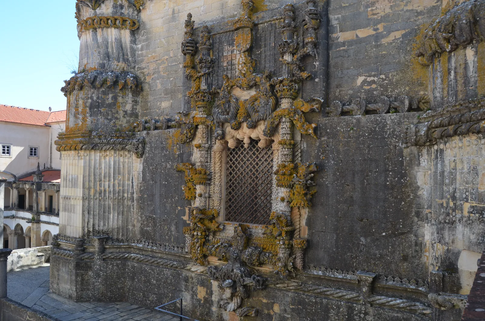 The Manueline chapter house window of the Convent of Christ, carved with ropes, coral, roots and a sailor's head
